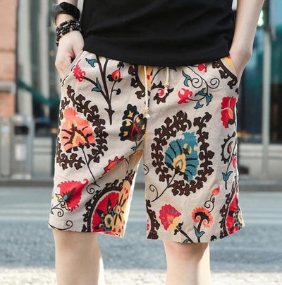 Men's linen beach shorts with colorful floral print design and drawstring waist